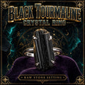 Ring set with a raw black tourmaline crystal in a metal band.
