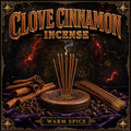 Clove cinnamon incense burning, warm spice smoke rising beside cinnamon bark and whole cloves.