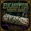 Eucalyptus white sage smudge stick from Dallas Psychic and Crystals: sage bundle bound with silvery blue-green eucalyptus leaves, on purple velvet with gold framing.