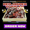 Tray of polished Red Jasper tumbled stones at Dallas Psychic & Crystals. Energetic root chakra healing crystal for grounding, protection, and physical strength.
